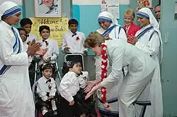 First Lady of the USA Laura Bush interacting with disabled children on her visit to Mother Teresa Light of Life Home (Jeevan Jyothi) for disabled children in New Delhi on 2 March 2006.