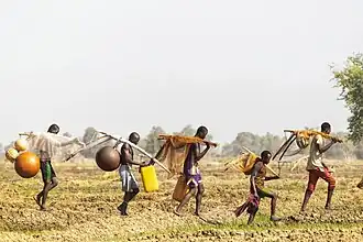 Nigerian fishermen with bottle gourds and fishnets
