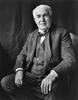 Black and white portriat picture of an elderly, stern, and finely dressed Thomas Edison in 1922