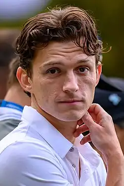 A picture of Tom Holland looking towards the camera