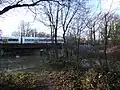 The Medway flows through Tonbridge in many channels. The South Eastern Main Line crosses the Medway.