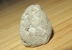 Trachytic pumice from the 2021 Fukutoku Okanoba eruption, showing exterior clast vesicularity and fibrous texture