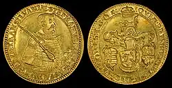 A golden coin depicting an armored middle-aged man on one side, and a coat-of-arms on the other side