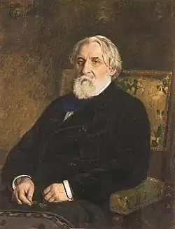 Oil painting of a bearded man with white hair, seated in an armchair and dressed in a dark coat