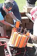 Clay targets being placed in an automatic throwing machine