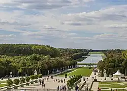 Image of a portion of the gardens of Versailles seen from in front of the palace's garden façade