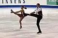 Side by side spins Tiffany Vise and Derek Trent