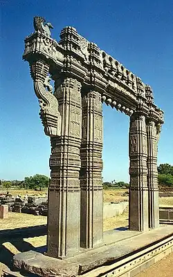 Kakatiya Kala Thoranam (Warangal Gate) built by the Kakatiya dynasty in ruins; one of the many temple complexes destroyed by the Delhi Sultanate.[35]