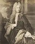 A three quarter length black and white engraved portrait of William Dummer. He is wearing fashionable early 18th century clothing and a long wig.