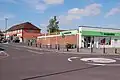 Street scene with modern brick built shop.