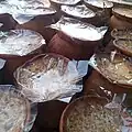 Sweet yogurt, made and contained in pots of clay are kept for sale, Bangladesh
