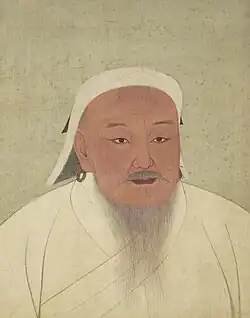 Portrait of an old, bearded Genghis dressed in white clothing