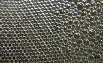 Hexagonal order of bubbles in a foam.