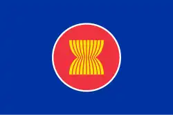 Ten yellow rice stalks on a red circle with a blue background