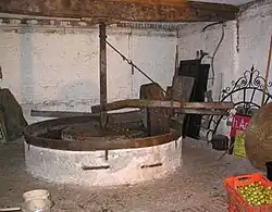 Traditional stone mill for making perry at Hellens, Herefordshire. The varieties 'Hellens Early' and 'Hellens Green' were named after the house.