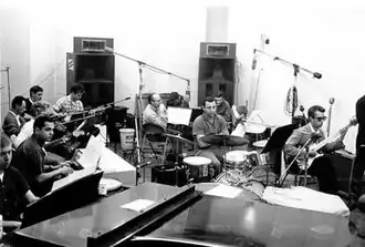 Members of the Wrecking Crew employed for a session at Gold Star Studios in the 1960s Seated left to right: Don Randi, Al De Lory, Carol Kaye, Bill Pitman, Tommy Tedesco, Irving Rubins, Roy Caton, Jay Migliori, Hal Blaine, Steve Douglas, and Ray Pohlman