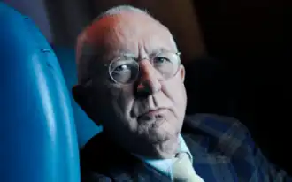Headshot of Len Deighton, looking at the camera