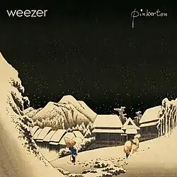 A village in a mountainous landscape at night. Men with conical hats walk in snow. In the top left, "Weezer" is written, and in the top right, "Pinkerton" is written.