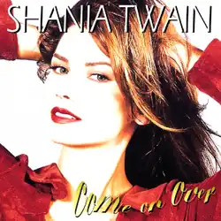 Photograph of a woman standing in front of a white background. She is wearing a red shirt and holding her hands in her hair, with her mouth ajar. The words SHANIA TWAIN are written at the top of the image in white capital letters. The words Come on Over are written at the bottom of the image in yellow cursive-style letters.