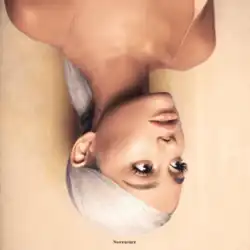 A portrait of Grande in platinum blonde hair, shown upside down. Looking to the right side of the image, she wears a sleeveless shirt and a nude lipstick, the latter of which matching the color of the background and the shirt. At the bottom of the cover art, small text that reads "Sweetener" is displayed in black.
