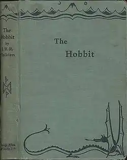 A light green cloth book cover featuring the book title in plain letters. At the top is a line drawing of a mountain range under the sun and moon; at the bottom is a line drawing of a dragon with its tongue out and wings erect.