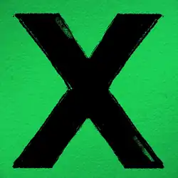 A large black x in a green background